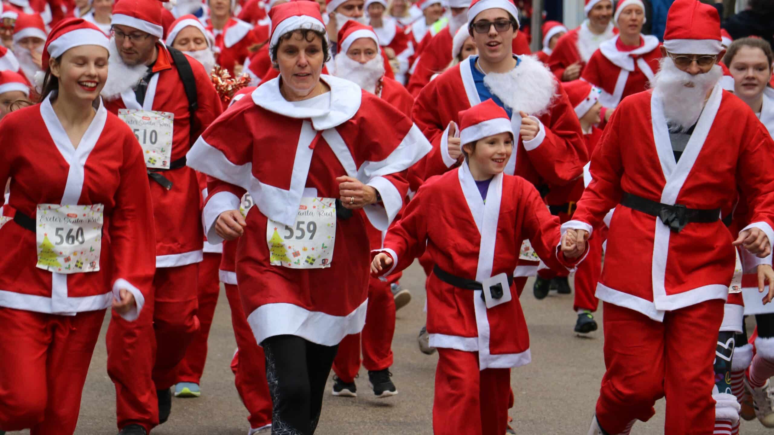 Runners in santa outfits